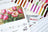 Lucas embroidery thread collection with a painting of tulips and thread color swatches.
