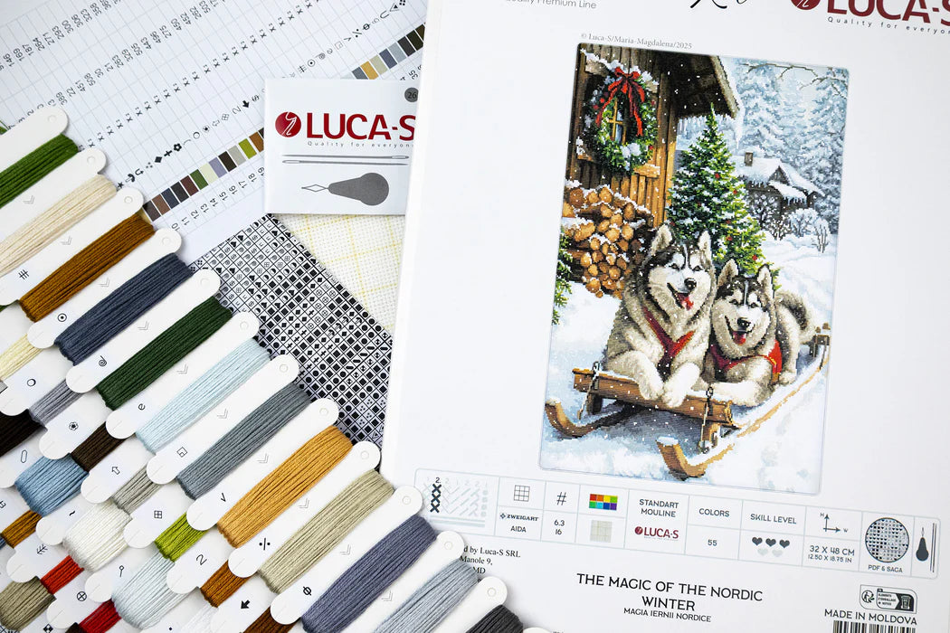 Color swatch book and embroidery kit with huskies on a snowy cabin cover