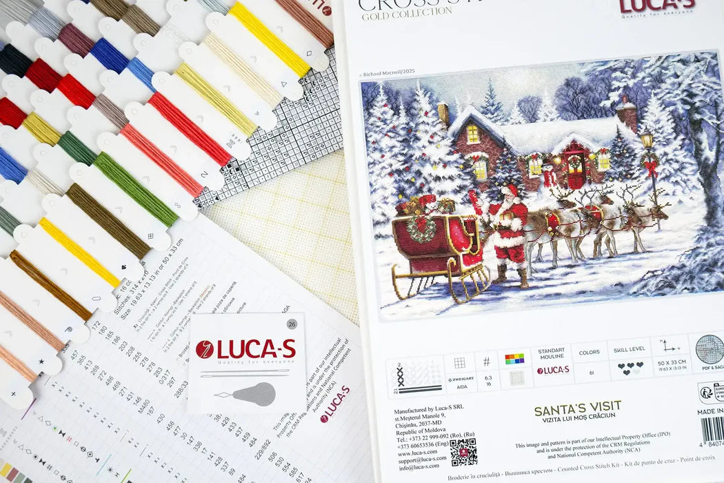 Lucas paint set with color swatches and a Christmas-themed painting of Santa Claus.