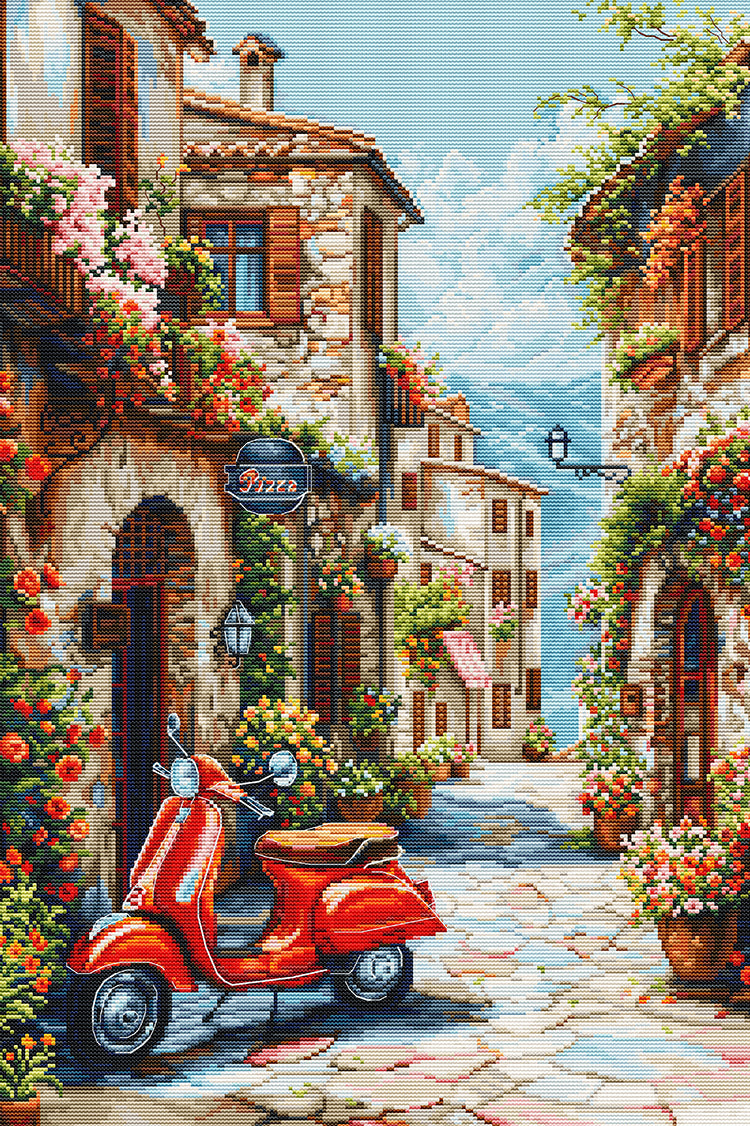Decorative image of a quaint Italian street with a red scooter, flowers, and stone buildings.