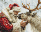 Cross-stitched pattern of Santa Claus with a reindeer in a snowy scene