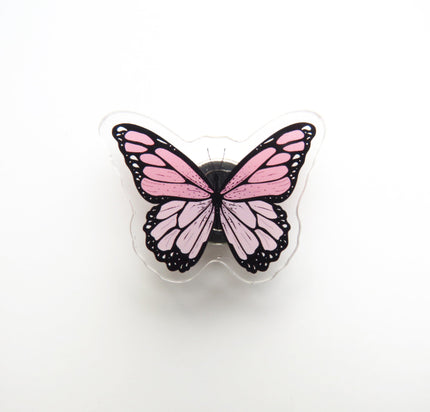 Pink butterfly-shaped needleminder on a white background