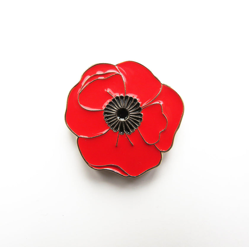 Red poppy flower needleminder on a white background