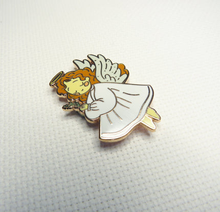 Angel needleminder with wings and halo on a white background