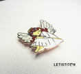 Angel-shaped needleminder on a white background with 'LETIStitch' branding.