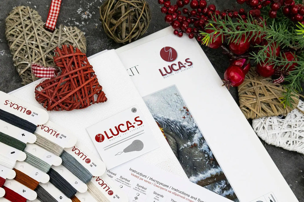Lucas brand materials including fabric swatches and a leaflet on a textured surface with decorative elements.