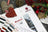 Lucas brand materials including fabric swatches and a leaflet on a textured surface with decorative elements.