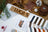 Color swatches and material samples on a wooden surface with 'LUCAS' branding.