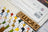 Color swatch book with 'Lucas' branding and a close-up of thread spools.
