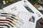 Lucas embroidery thread set with color swatches and product catalog on a textured surface.