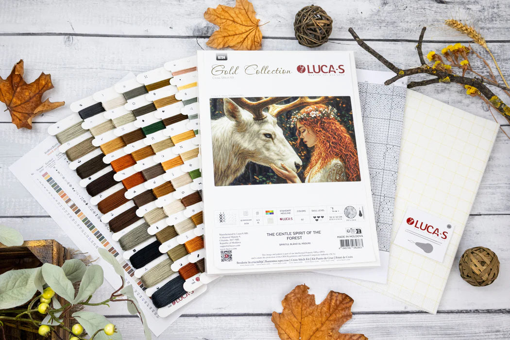 Lucas embroidery thread color chart and packaging on a wooden surface with fall leaves and branches.