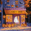 Halloween-themed candy shop with pumpkins and a ghost in front of a window.