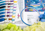 Embroidery hoop with floral design, thread colors, and Latch hook kit on a floral background