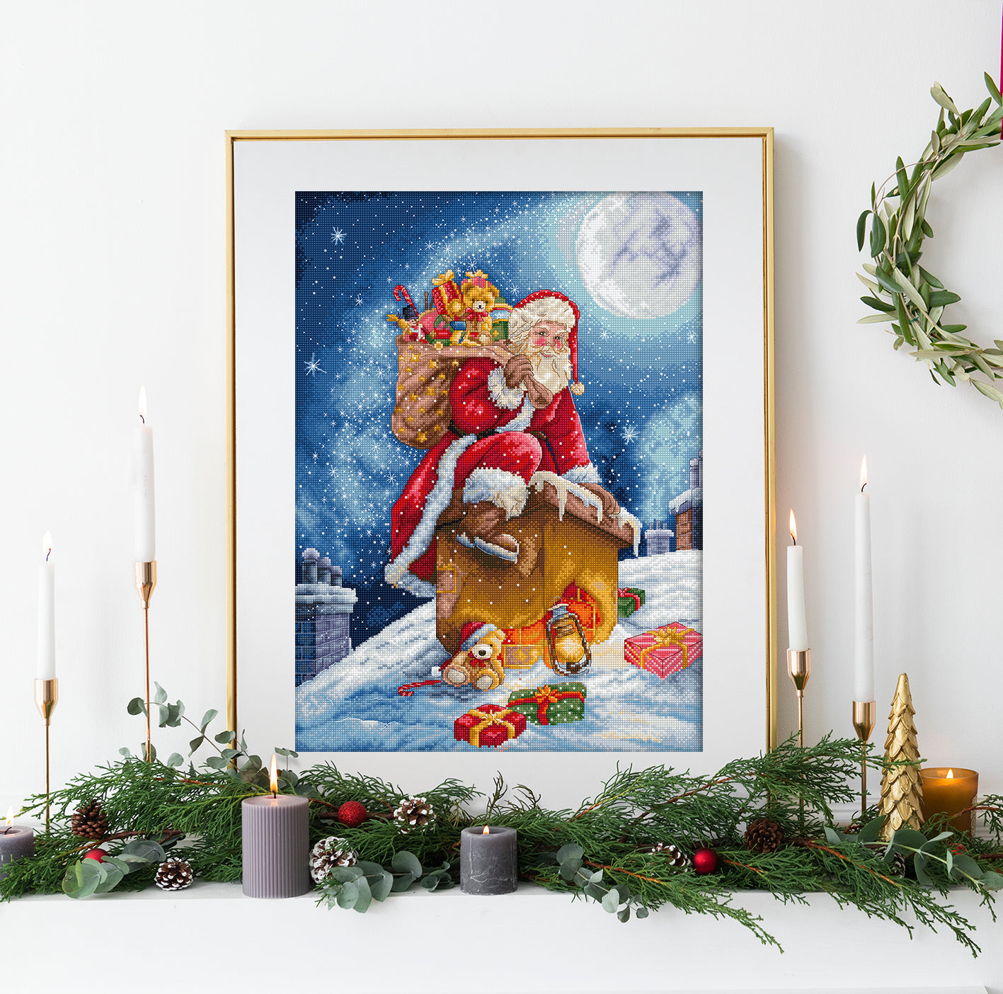 Framed artwork of Santa Claus on a sleigh with presents against a snowy night sky, displayed on a decorated Christmas mantel.