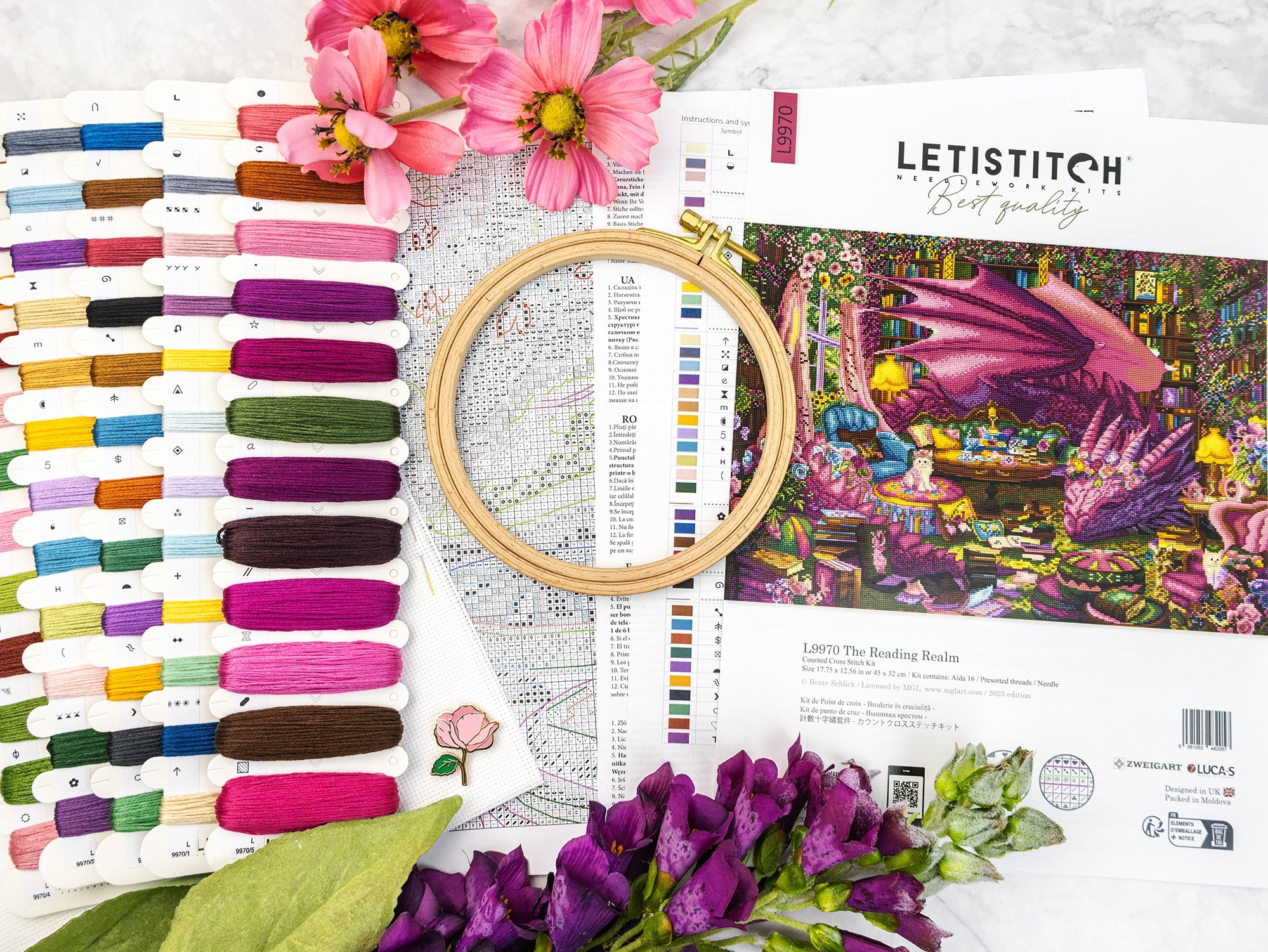 Embroidery kit with threads, hoop, and pattern on a white background