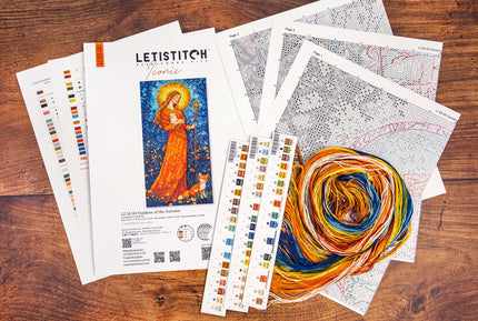 LetiStitch embroidery kit with pattern sheets and yarn on a wooden surface