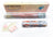 Diamond painting kit with roll of mesh, color chart, and packaging on a white background
