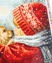 Close-up of a diamond painting piece with a red hat and scarf, featuring a pattern of snowflakes.