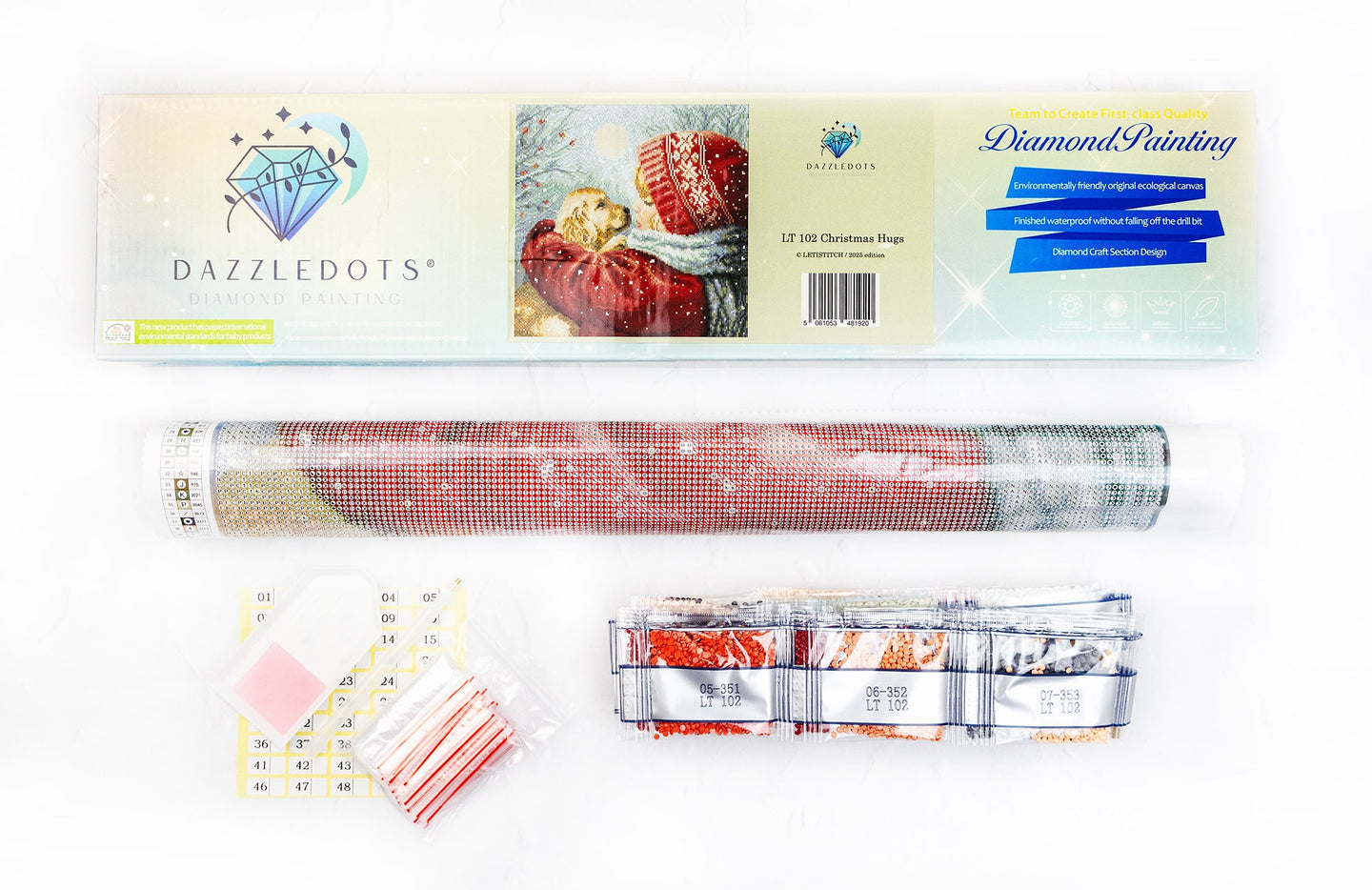 Dazzledots product packaging with a roll of red and white striped fabric and a small container on a white background.