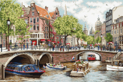 Dutch canal scene with boats, bridges, and traditional buildings.