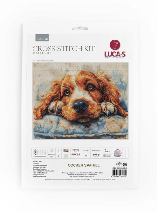 Cross stitch kit packaging featuring a Cocker Spaniel on a white background
