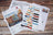Cross stitch kit with color swatches and pattern on a wooden surface
