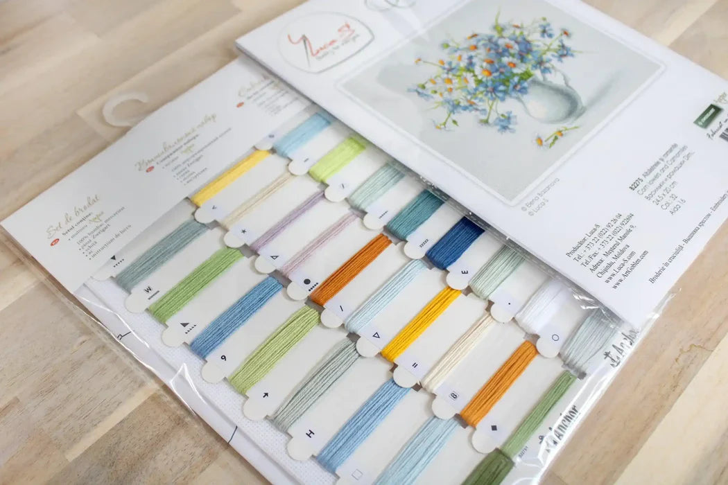 Color swatch book with fabric samples on a wooden surface