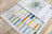Color swatch book with fabric samples on a wooden surface