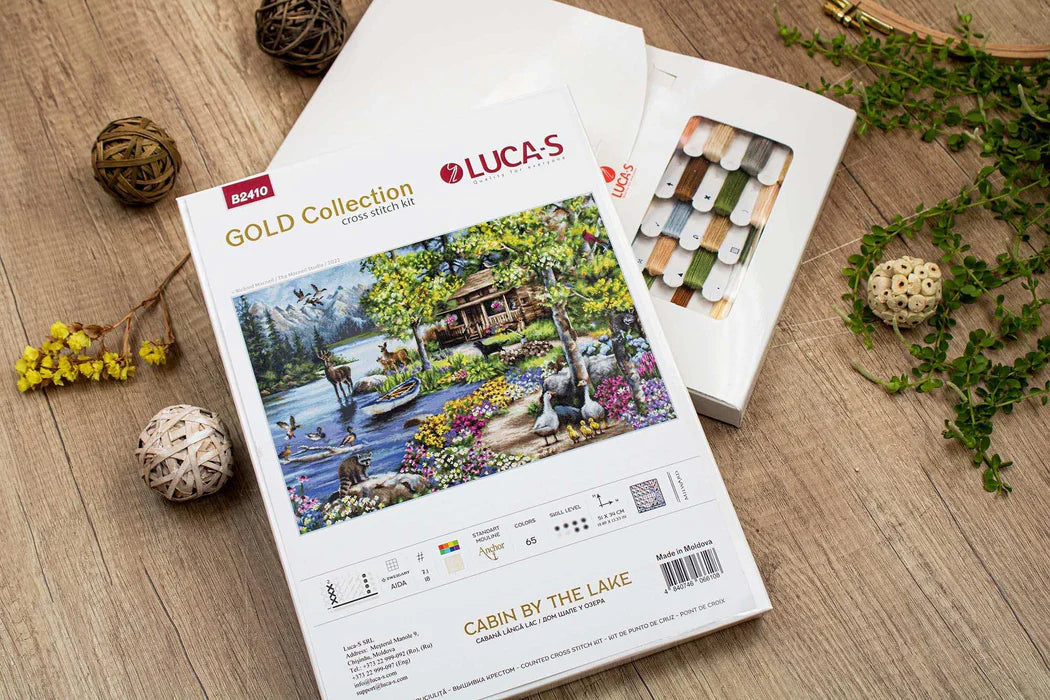 Lucas Gold Collection puzzle packaging with 'Cabin by the Lake' design on a wooden surface.