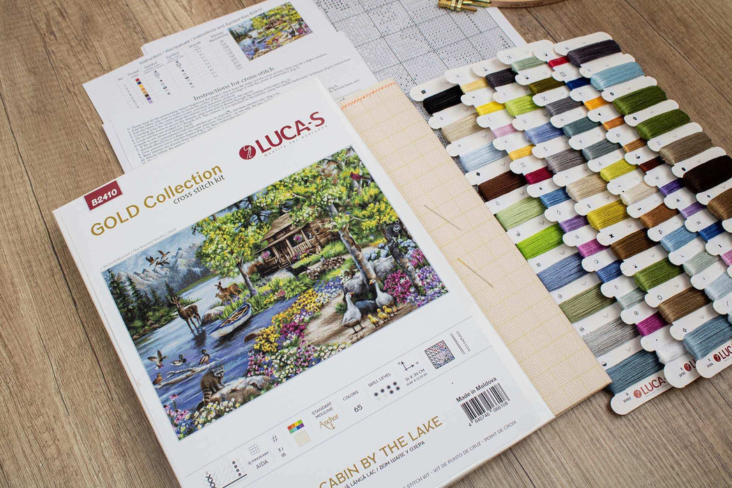 Lucas Gold Collection cross-stitch kit with color chart on a wooden surface