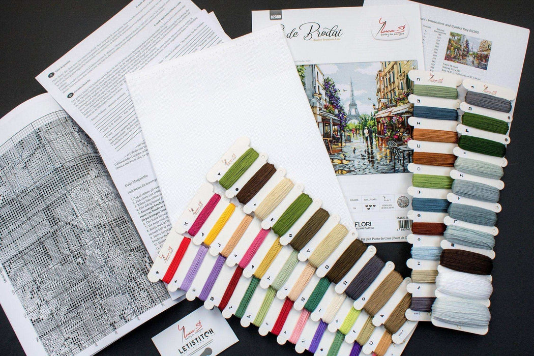 Color swatches and fabric samples on a table with design documents.