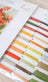 Set of colorful embroidery threads in a box with a brand logo.