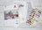 Cross stitch kit with pattern, threads, and instructions on a wooden surface