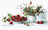 Strawberries and a teapot with flowers on a white background