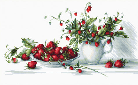 Strawberries and a teapot with flowers on a white background