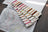 Set of embroidery thread samples with a cross-stitch pattern on paper