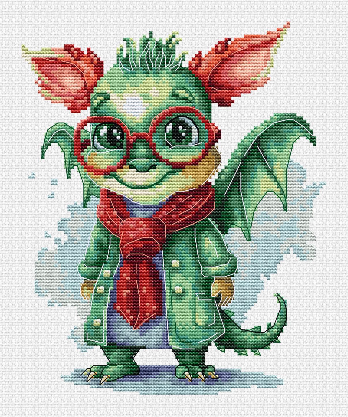 Cross-stitched design of a green dragon-like creature with red glasses and scarf on a white background