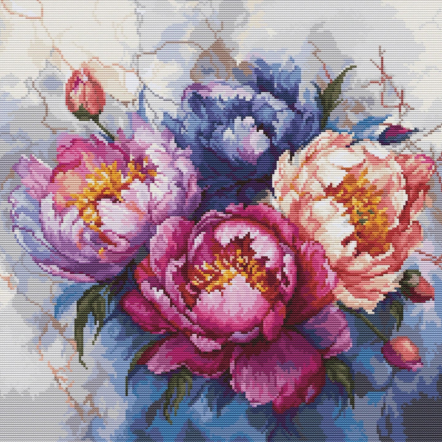 Colorful floral arrangement with pink, purple, and blue flowers on a textured background