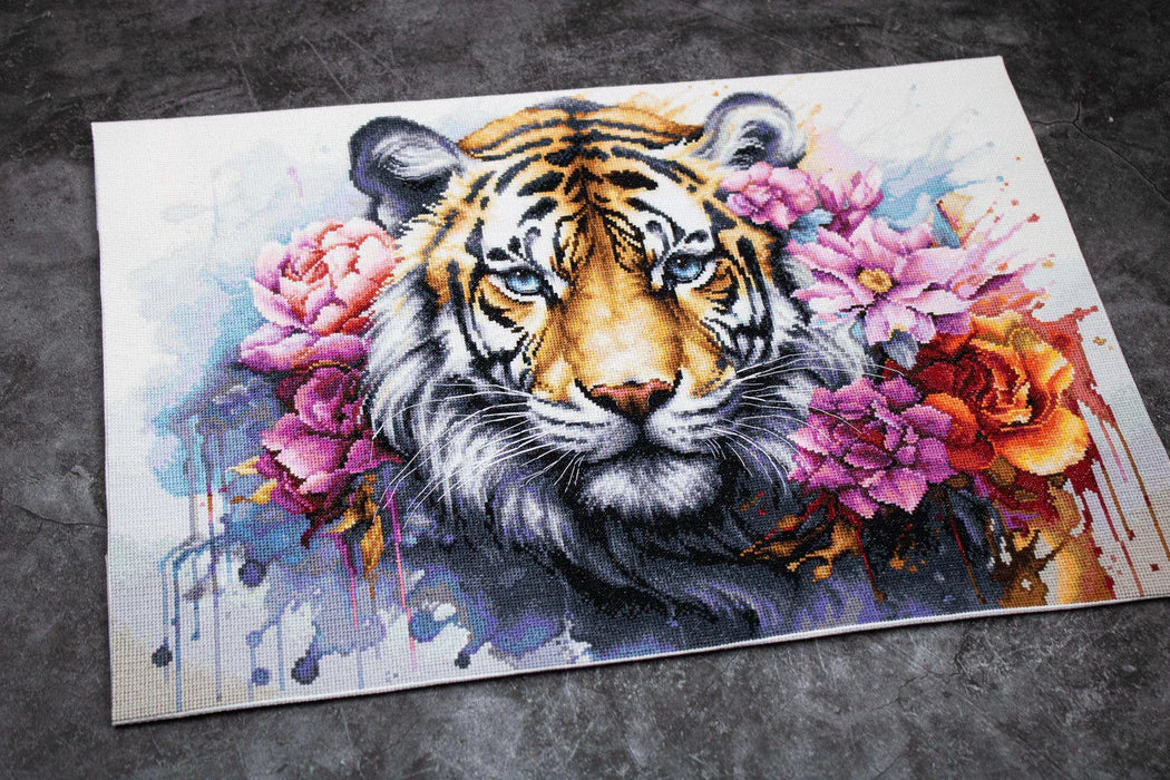 Artistic depiction of a tiger surrounded by colorful flowers on a textured surface.