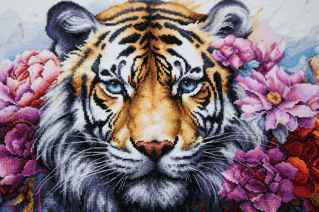 Cross-stitched tiger surrounded by flowers